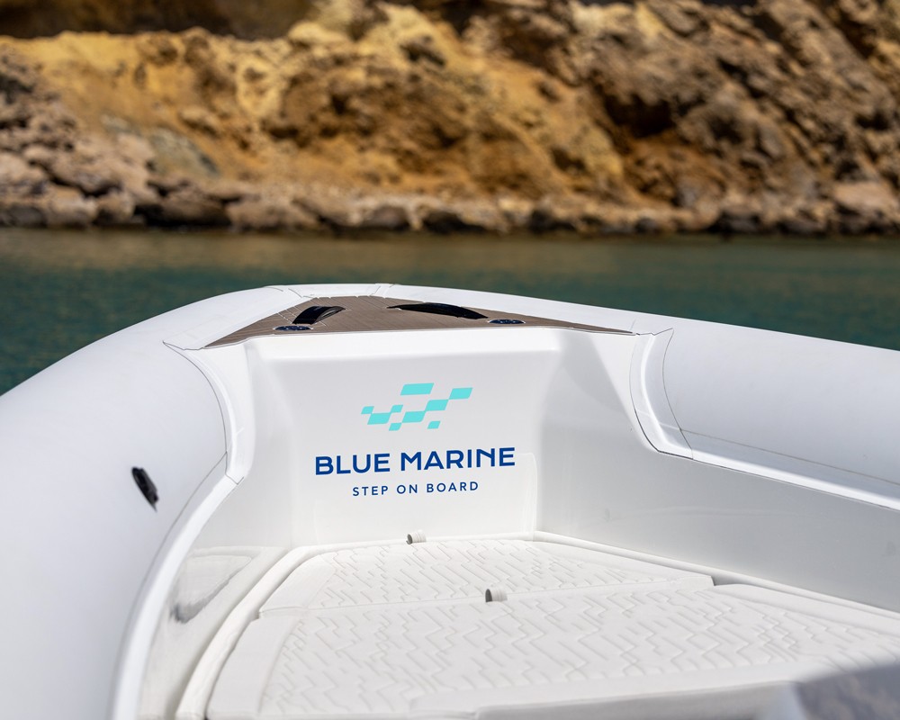 Application of the Blue Marine identity on a boat, embedding the brand directly into the cruising experience