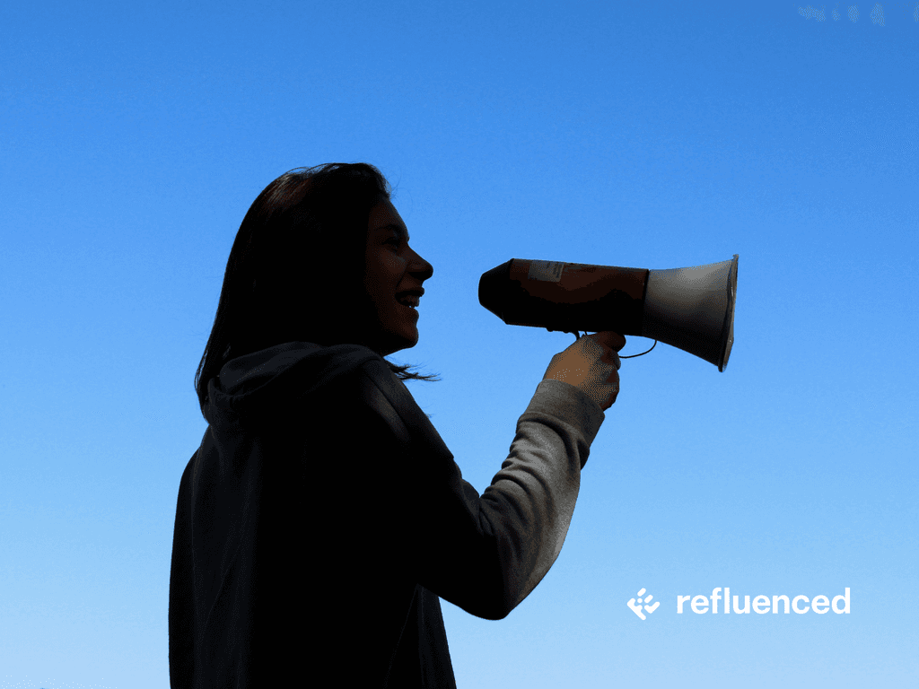 Girl speaking through a megaphone.