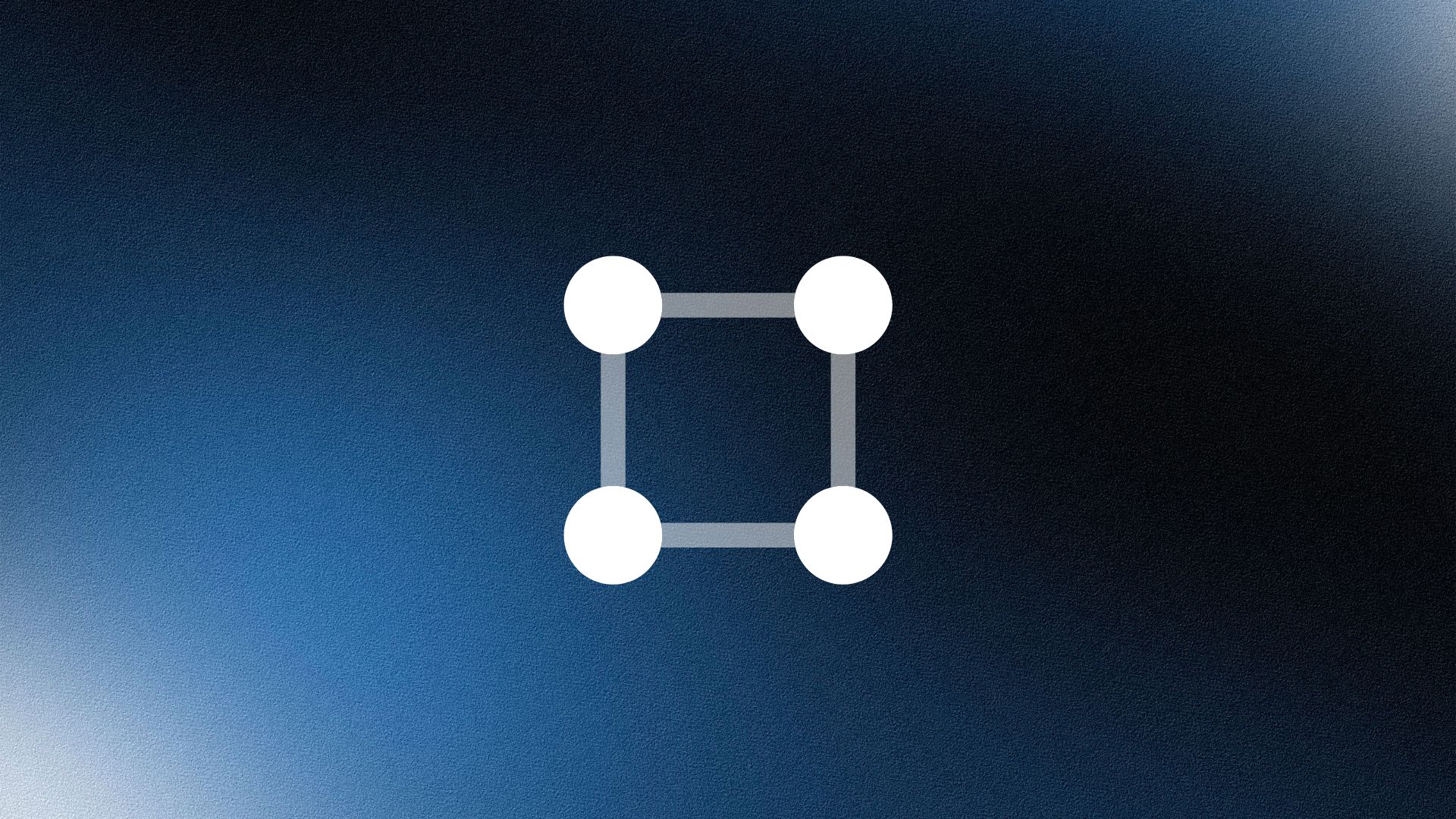 Smiling woman wearing a beige blazer and grey shirt, holding a folder while standing by a sunlit wall.