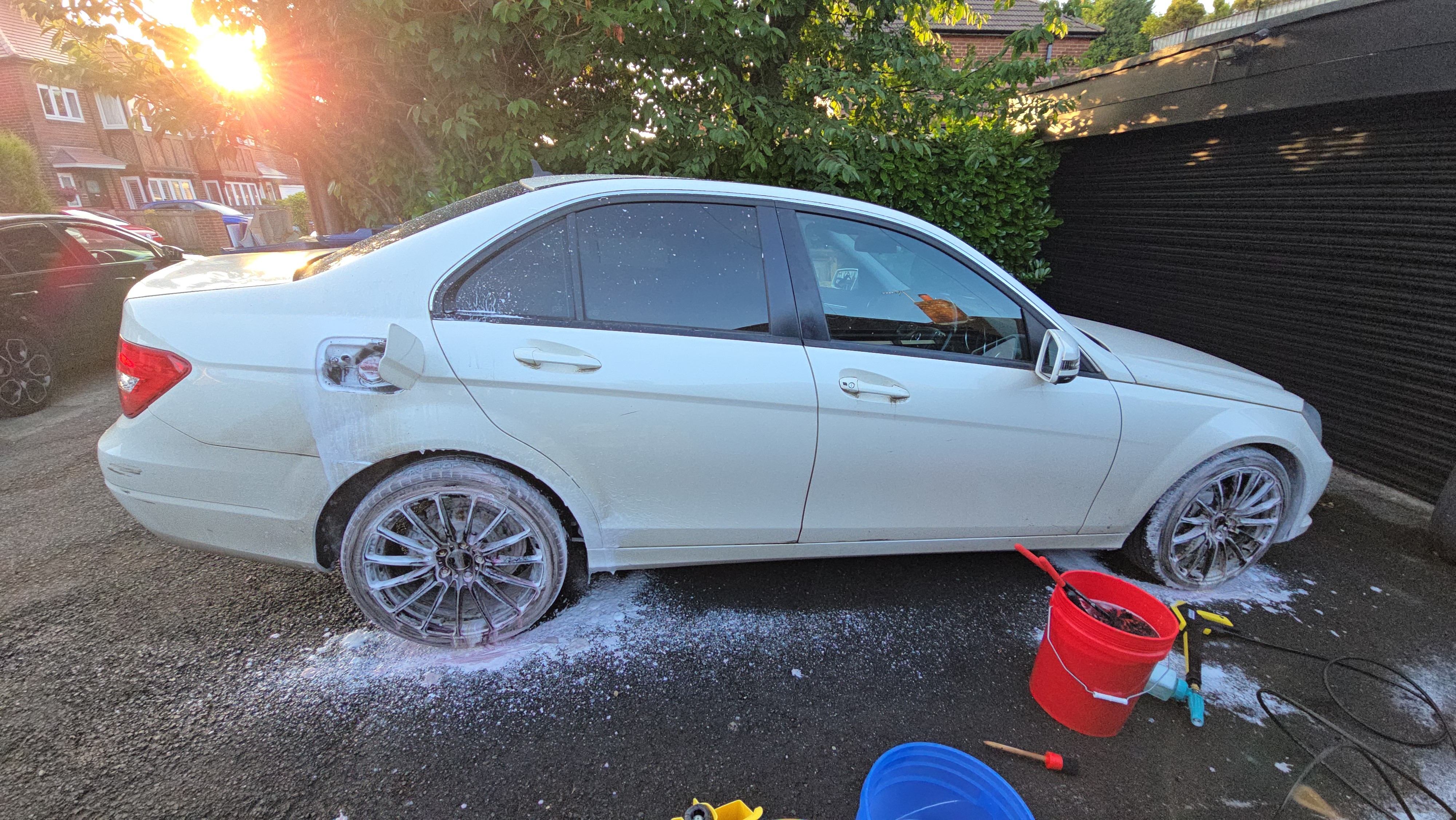 White Mercedes C-Class during paint-safe washing