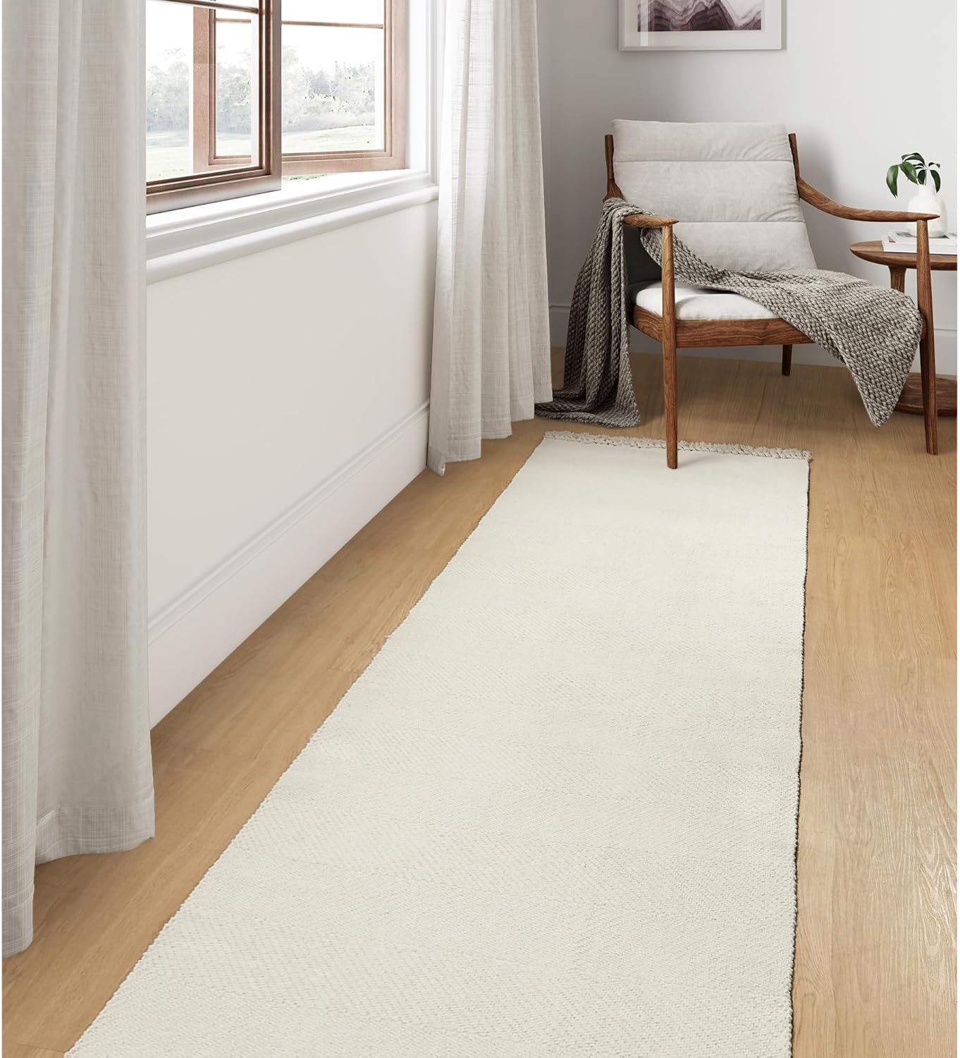 White runner rug adds a stylish touch to home decor.