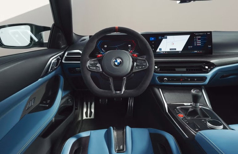 a close up of a steering wheel and dashboard of a car