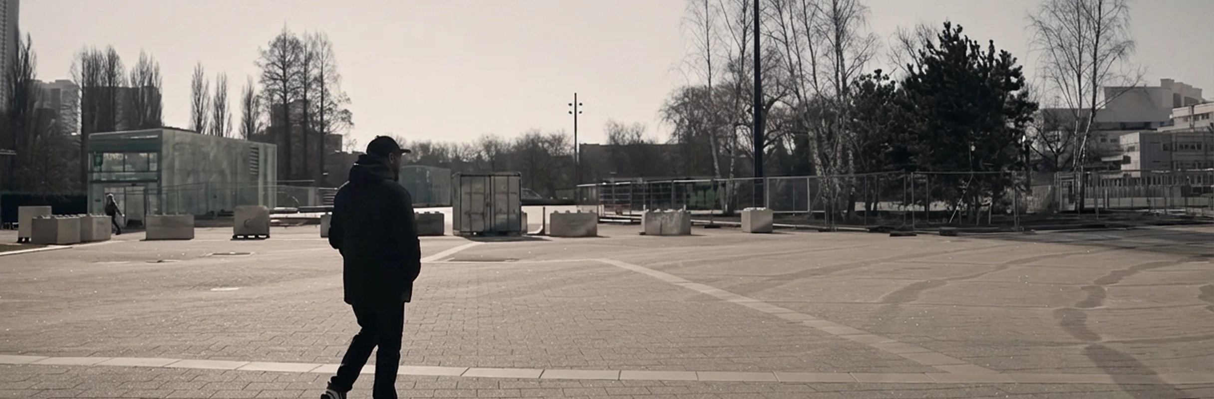 Randy walking through an open urban square in Rotterdam