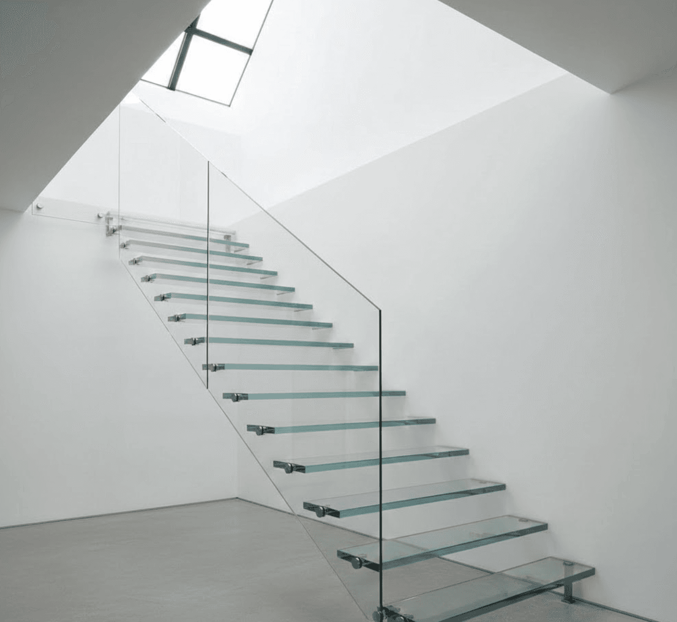 Image of  Floating glass staircase with cantilevered treads extending from white plaster wall. Crystal-clear 12mm glass treads with polished edges catching light. Frameless glass balustrade with minimal stainless steel standoffs at base. No visible handrail. Bright, airy space with natural light streaming from skylight above. Clean white walls, polished concrete floor below. Modern minimalist interior. Photorealistic architectural photography, eye-level perspective looking up staircase, soft natural lighting