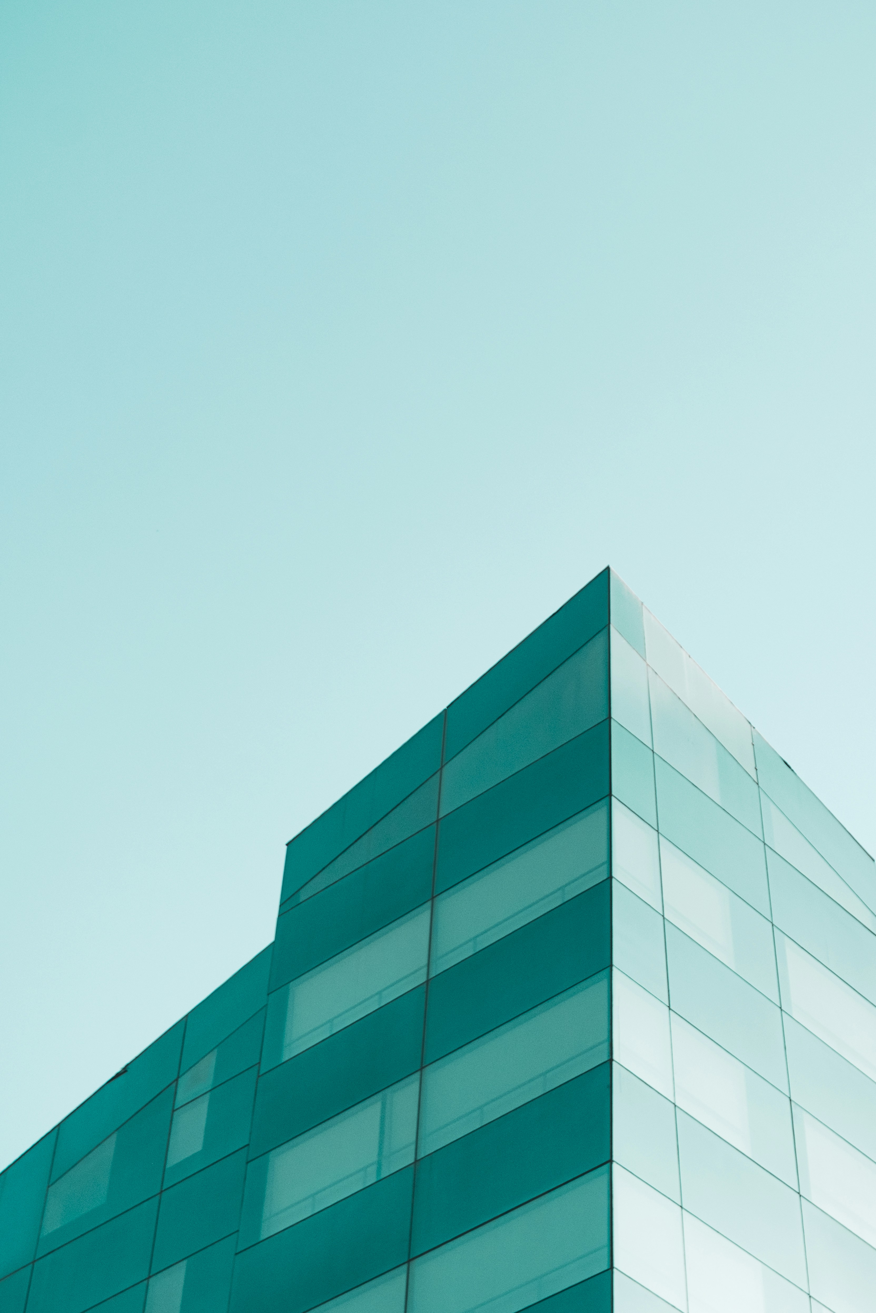 Modern glass building against a clear sky