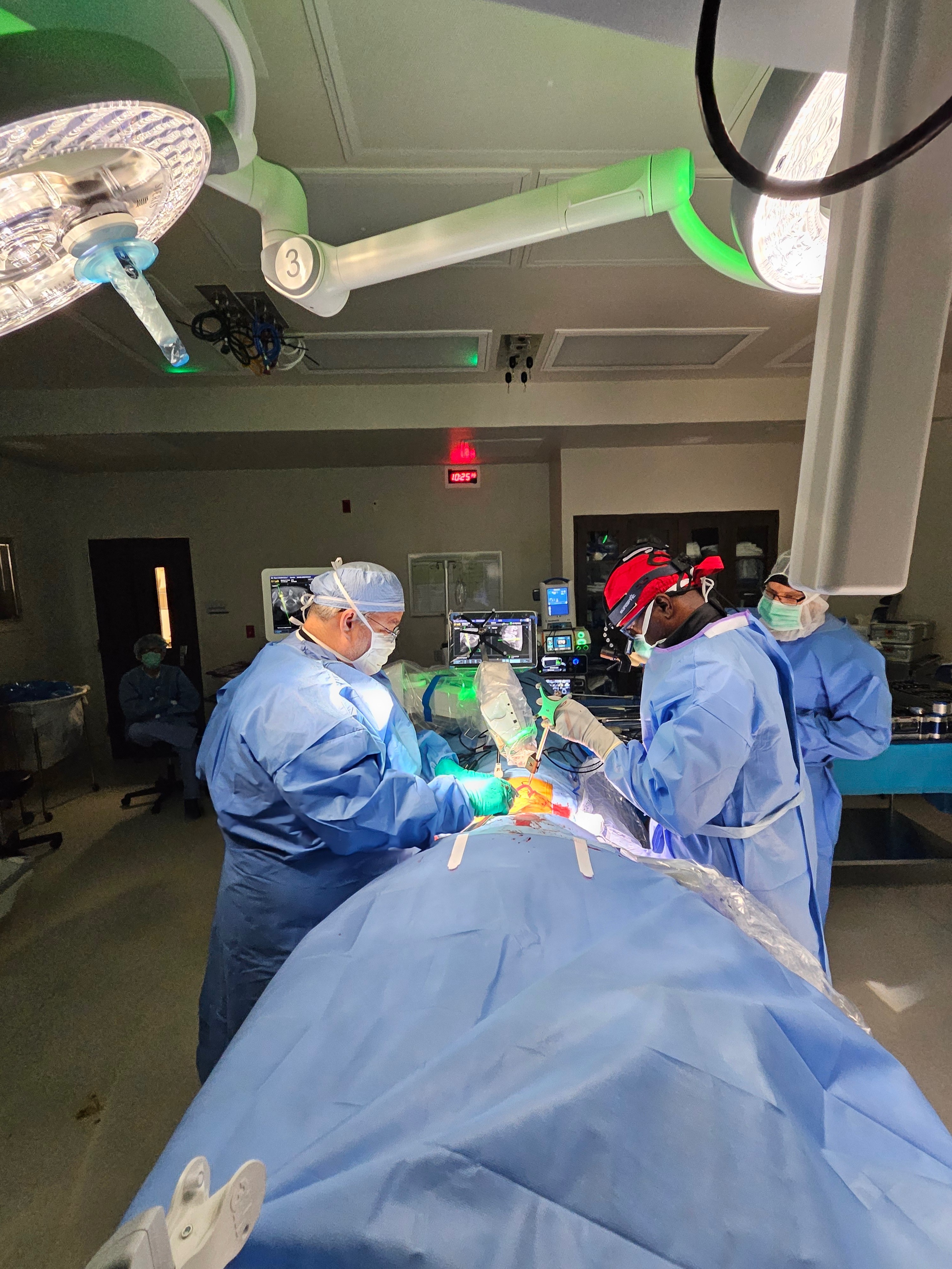 Surgical team performing a procedure in an operating room
