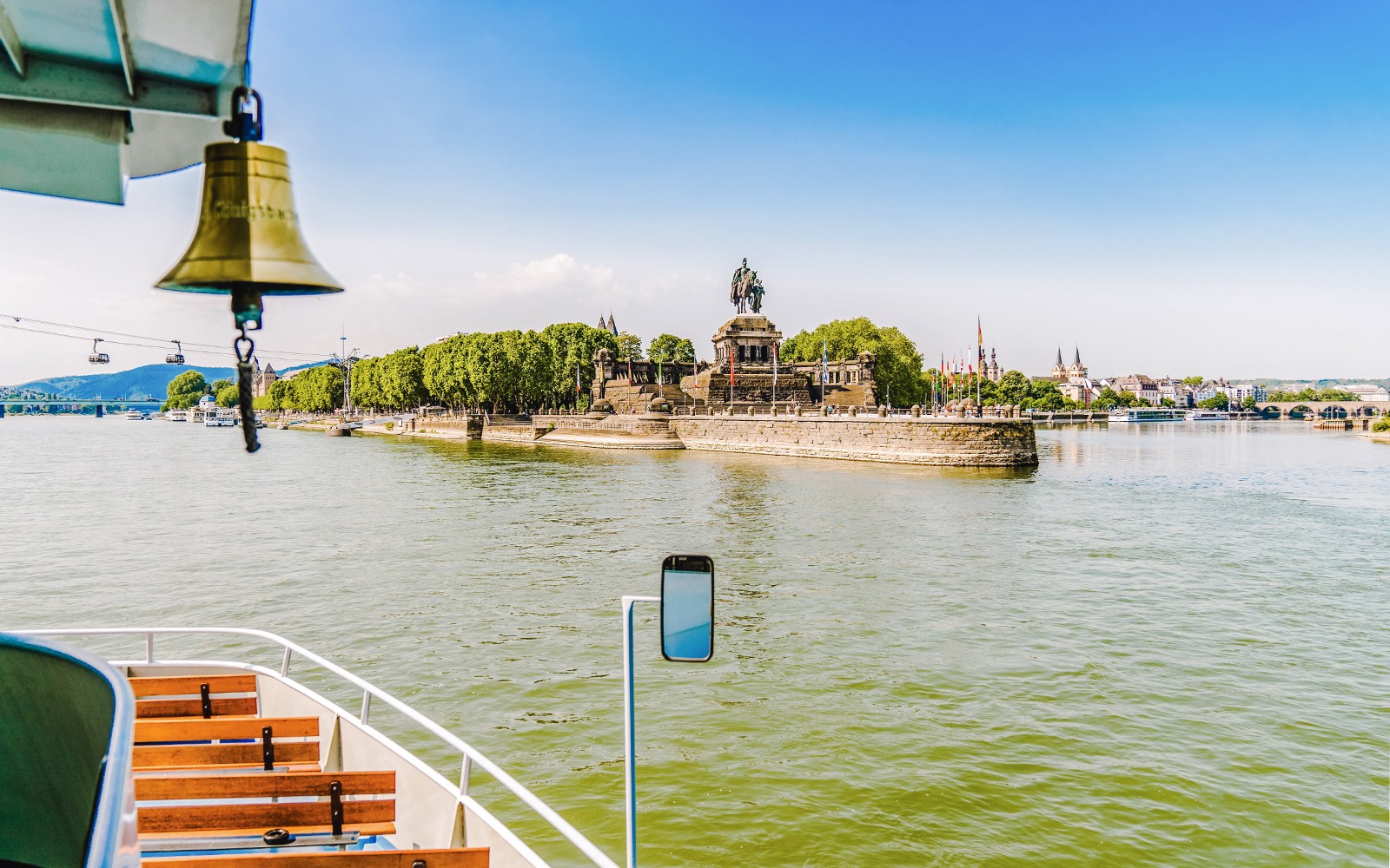 Koblenz sightseeing cruise view of Deutsches Eck monument at river confluence.
