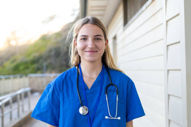Photo of a female doctor wearing scrubs.