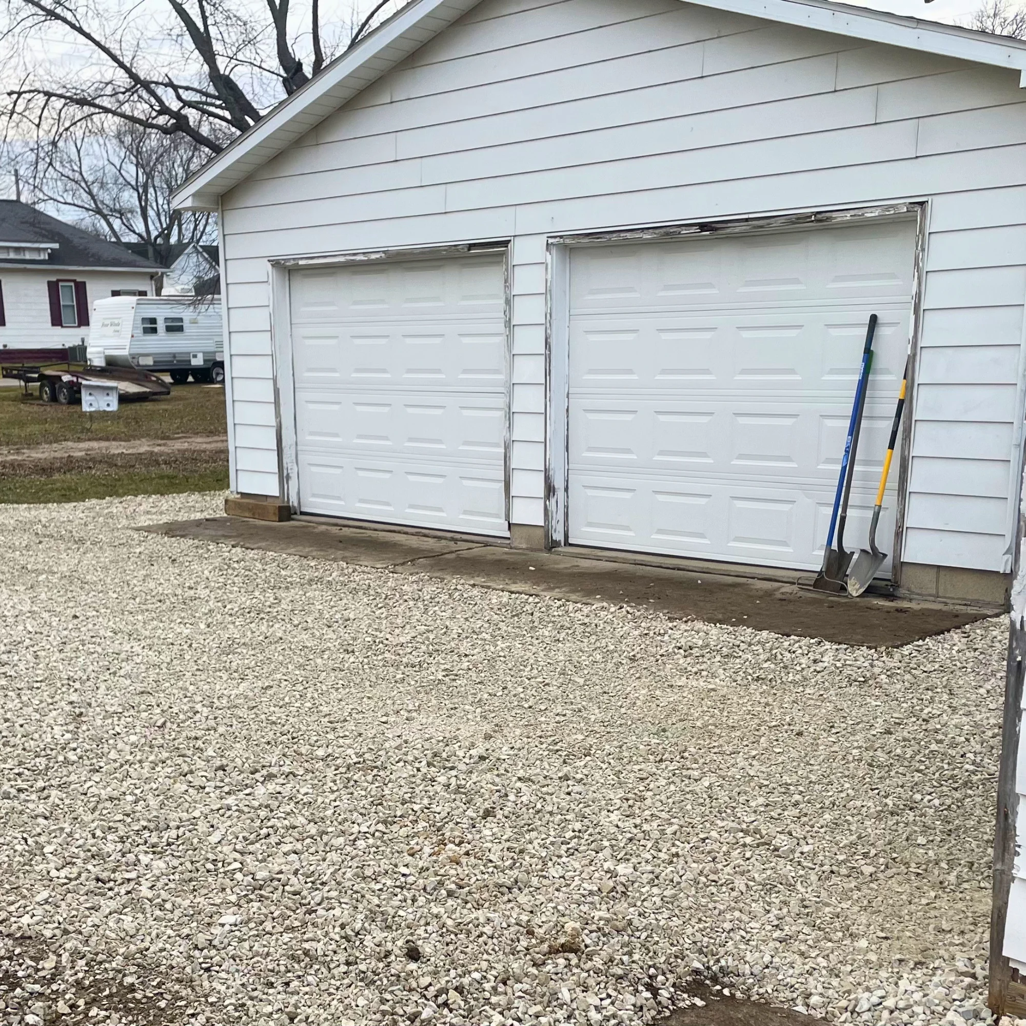 yellow and green excavator on rocky ground during daytime