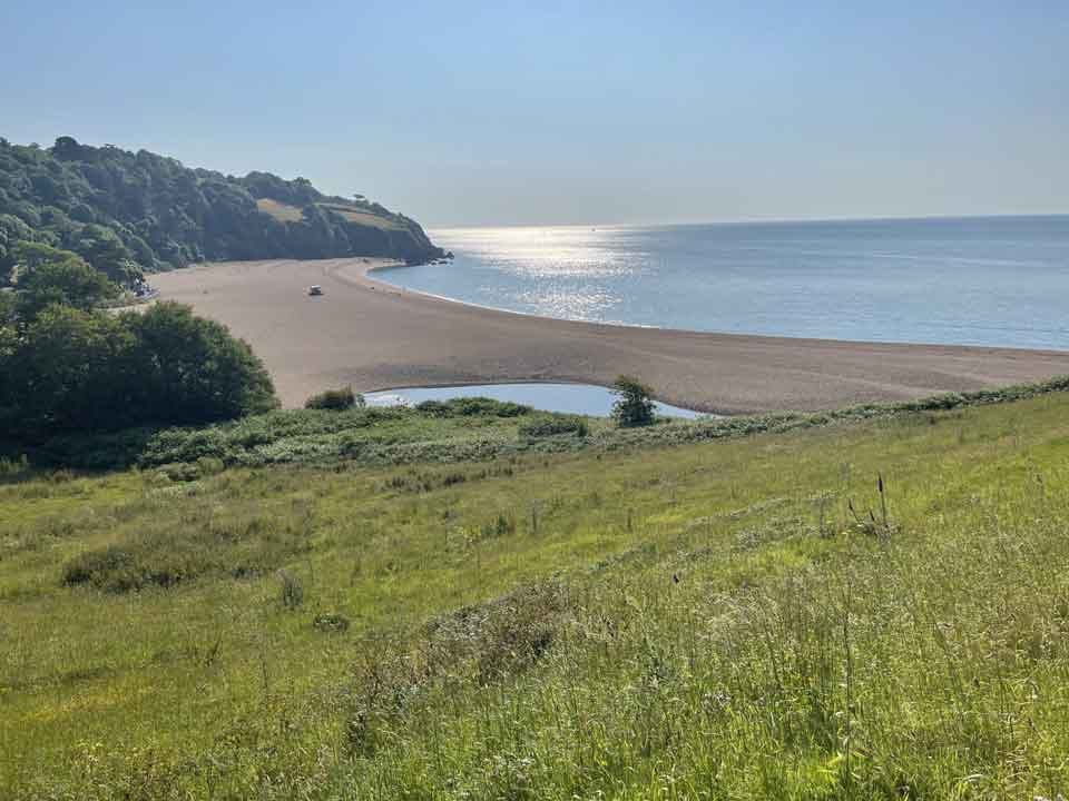 Feral Swan: restorative and ecotherapy – image of a sunny day at a secluded UK beach