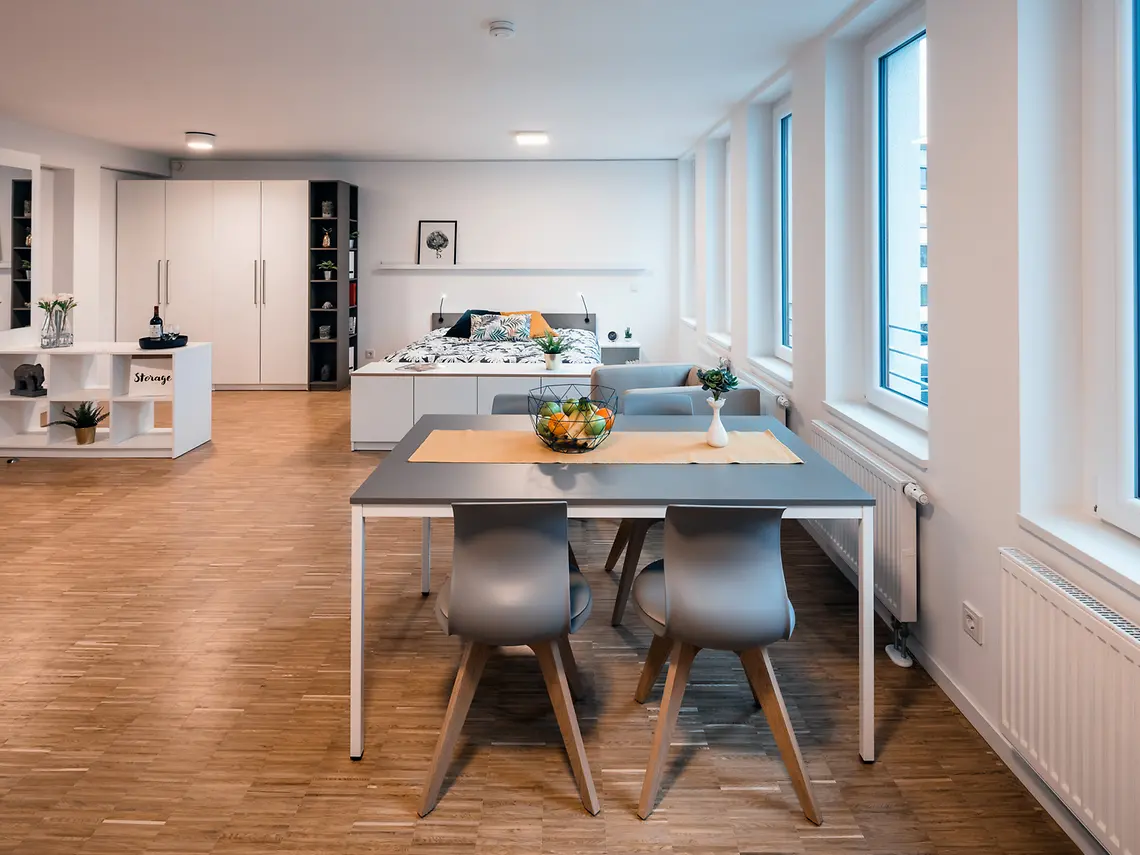 Spacious student studio in Frankfurt with dining area, bed and modern furnishings