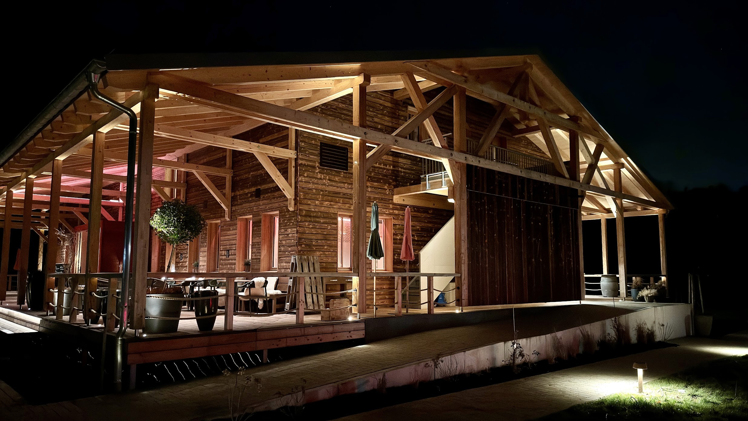 Aerial perspective showing the tower integrated within surrounding mid-rise blocks, geometric rooflines and linear streets forming a structured urban grid.