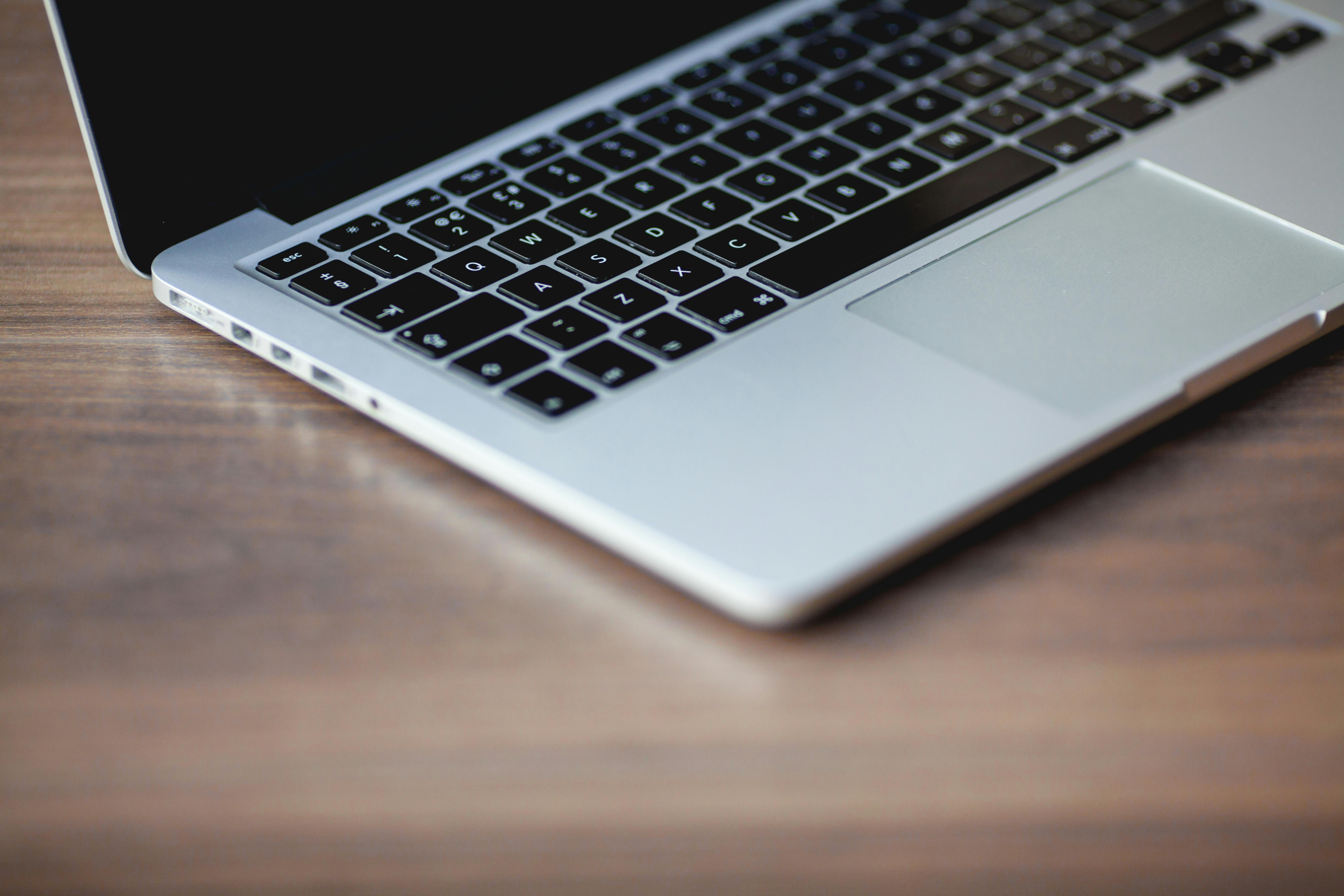Open laptop on a desk symbolizing communication and connection with PPT Solutions.