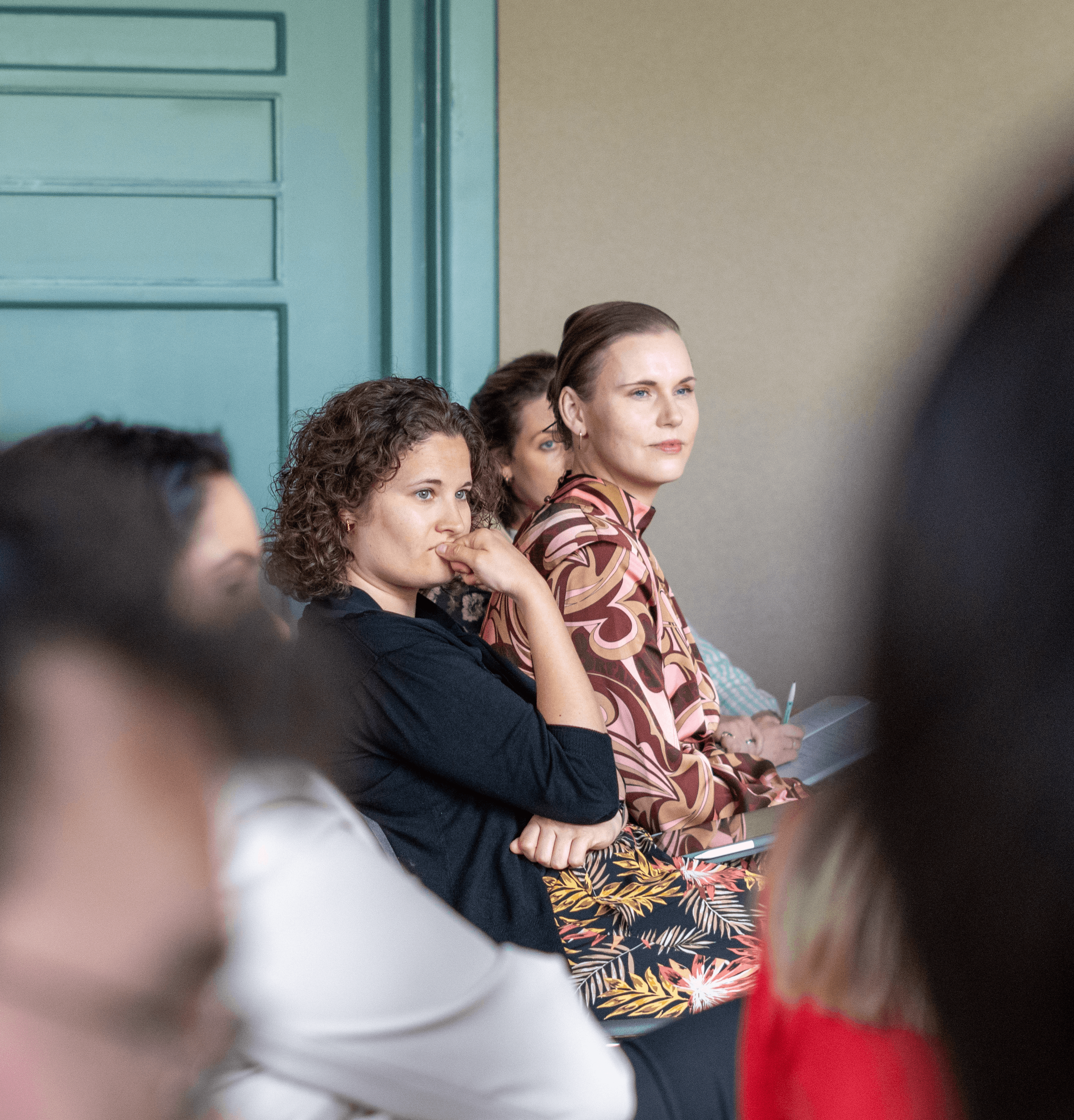 two women listening attentively