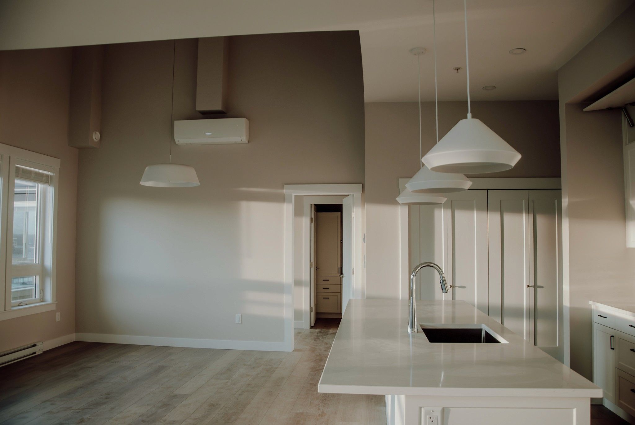 Modern kitchen with HVAC system in Chilliwack, Fraser Valley, British Columbia, showcasing plumbing and interior design.
