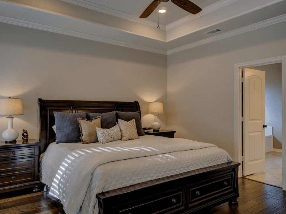 Warm, styled living room with fireplace repainted by AUPaint. Soft neutral tones and clean lines give the space a fresh, updated look.