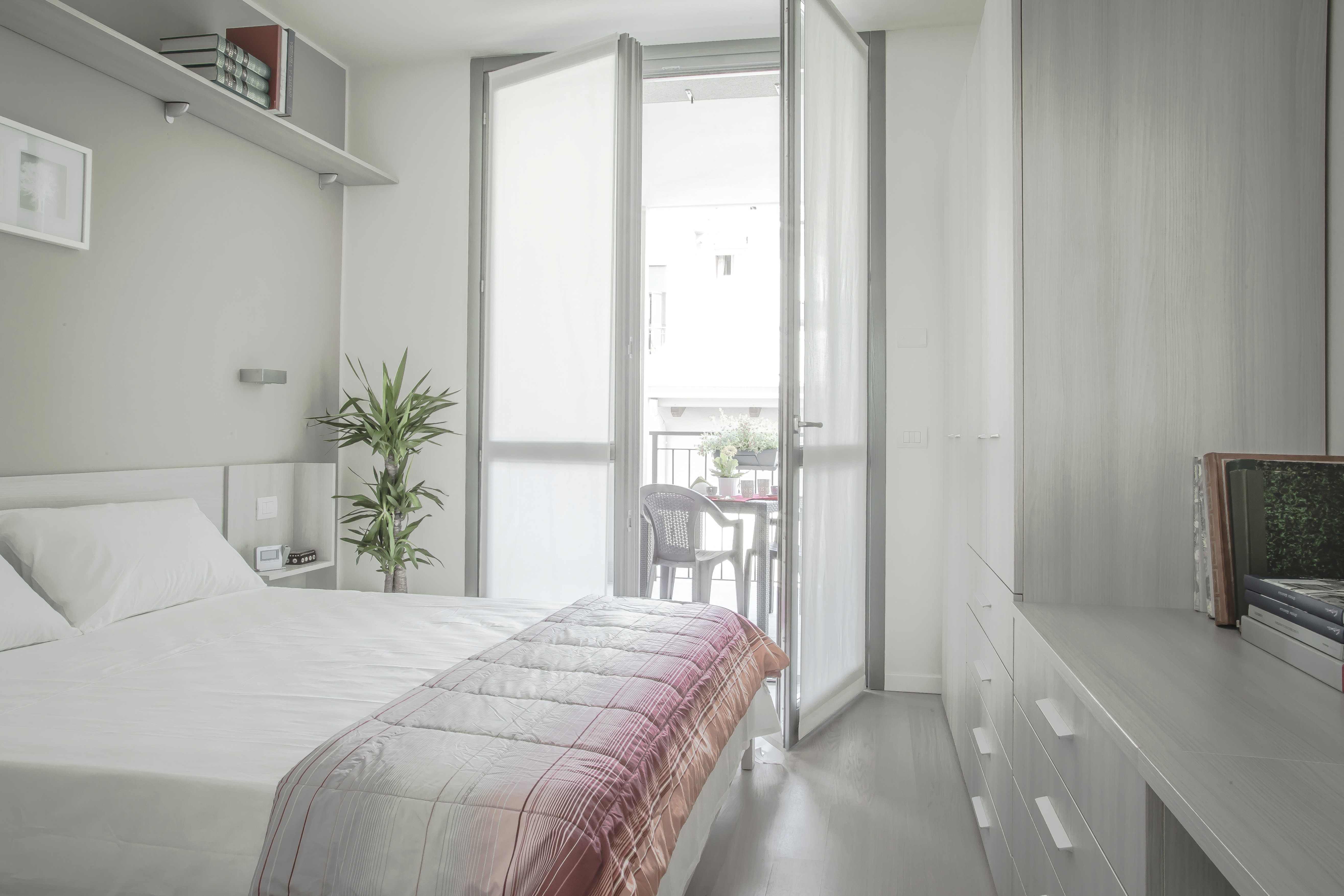 sunlit empty room with wooden floors