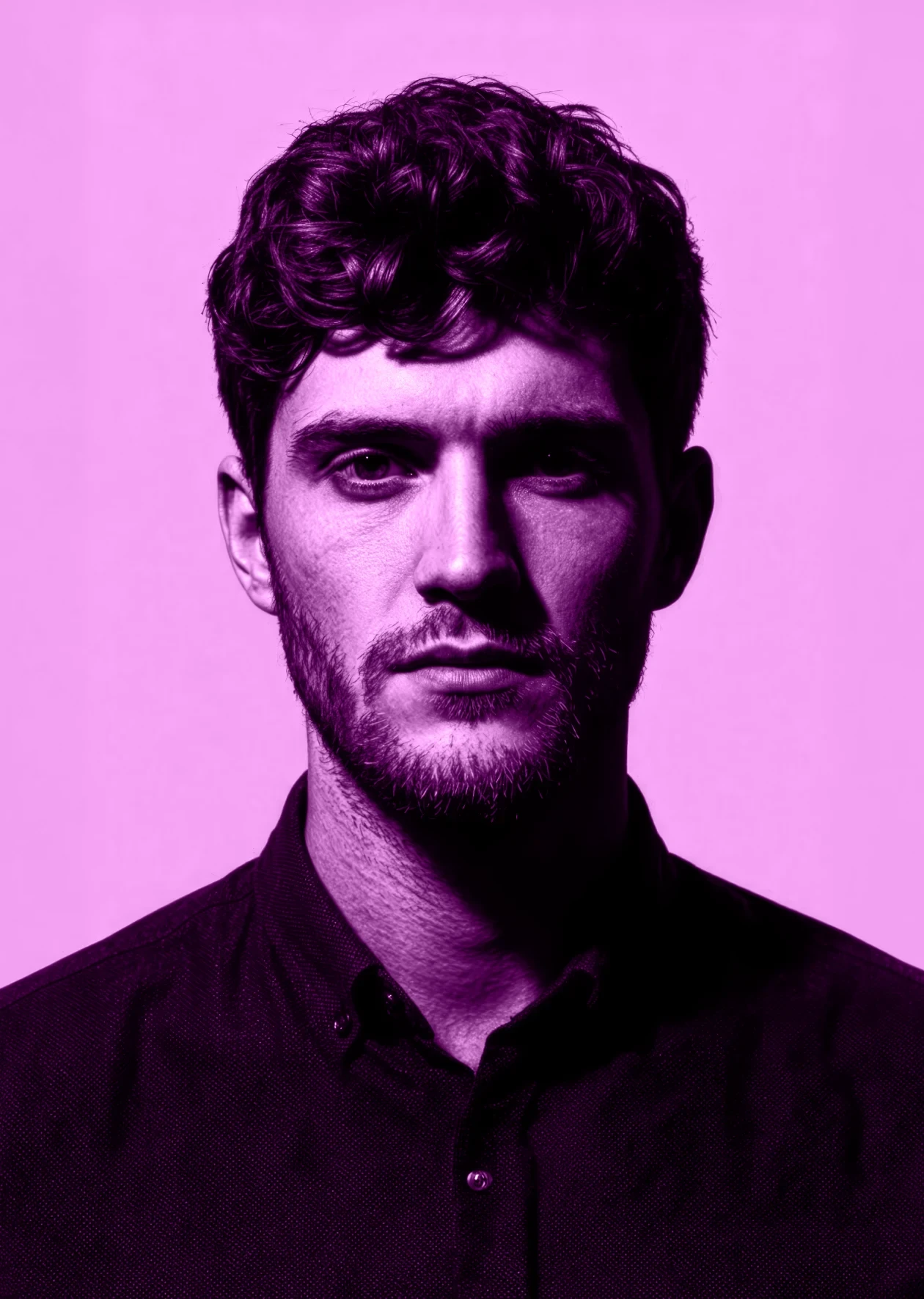 Front-facing portrait of Marcus Decker against a pink background.