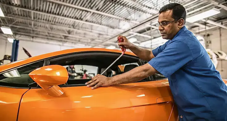 FIxing a car dent at Ideal Premier