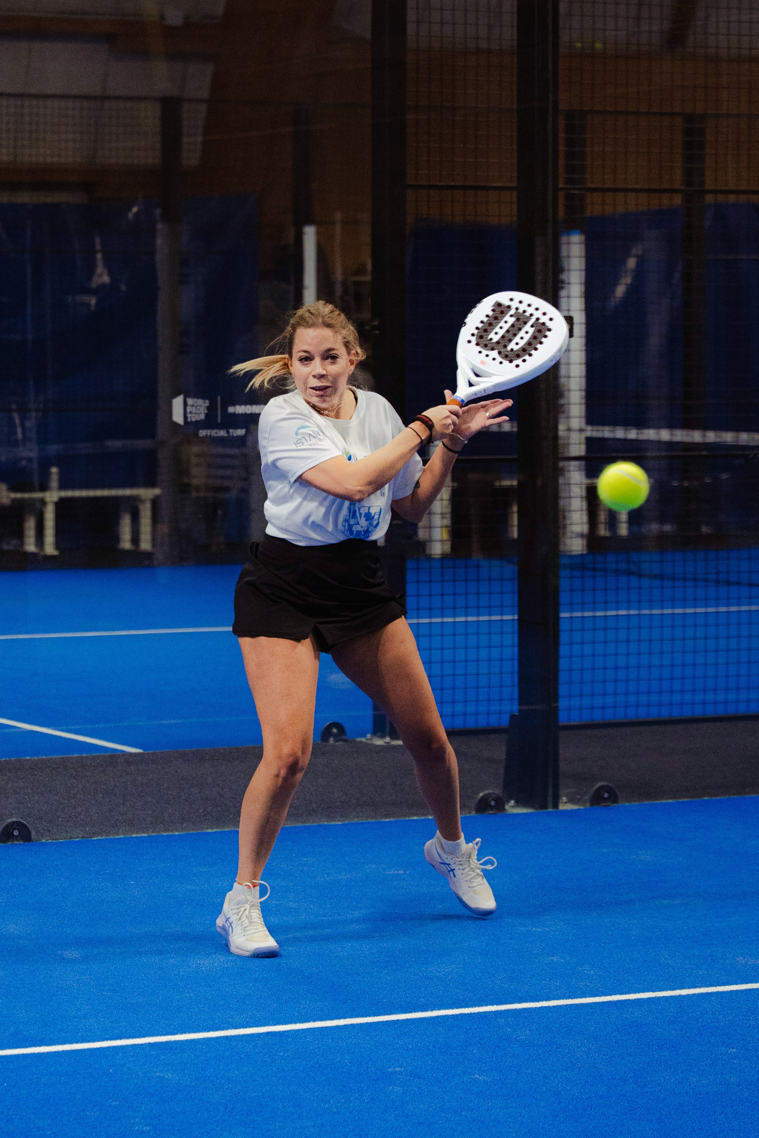 A women playing padel