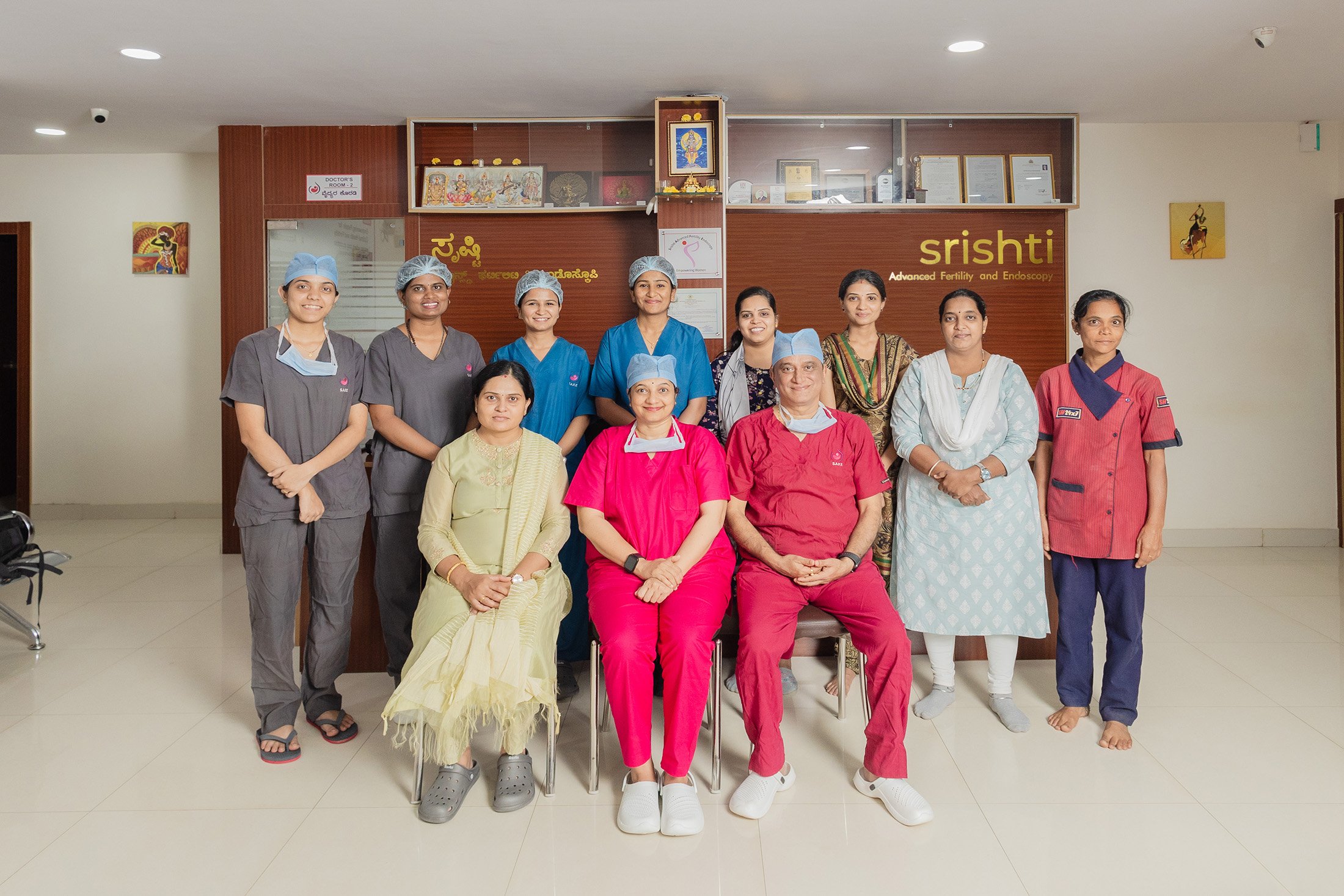 An empty road with a hospital in the background.