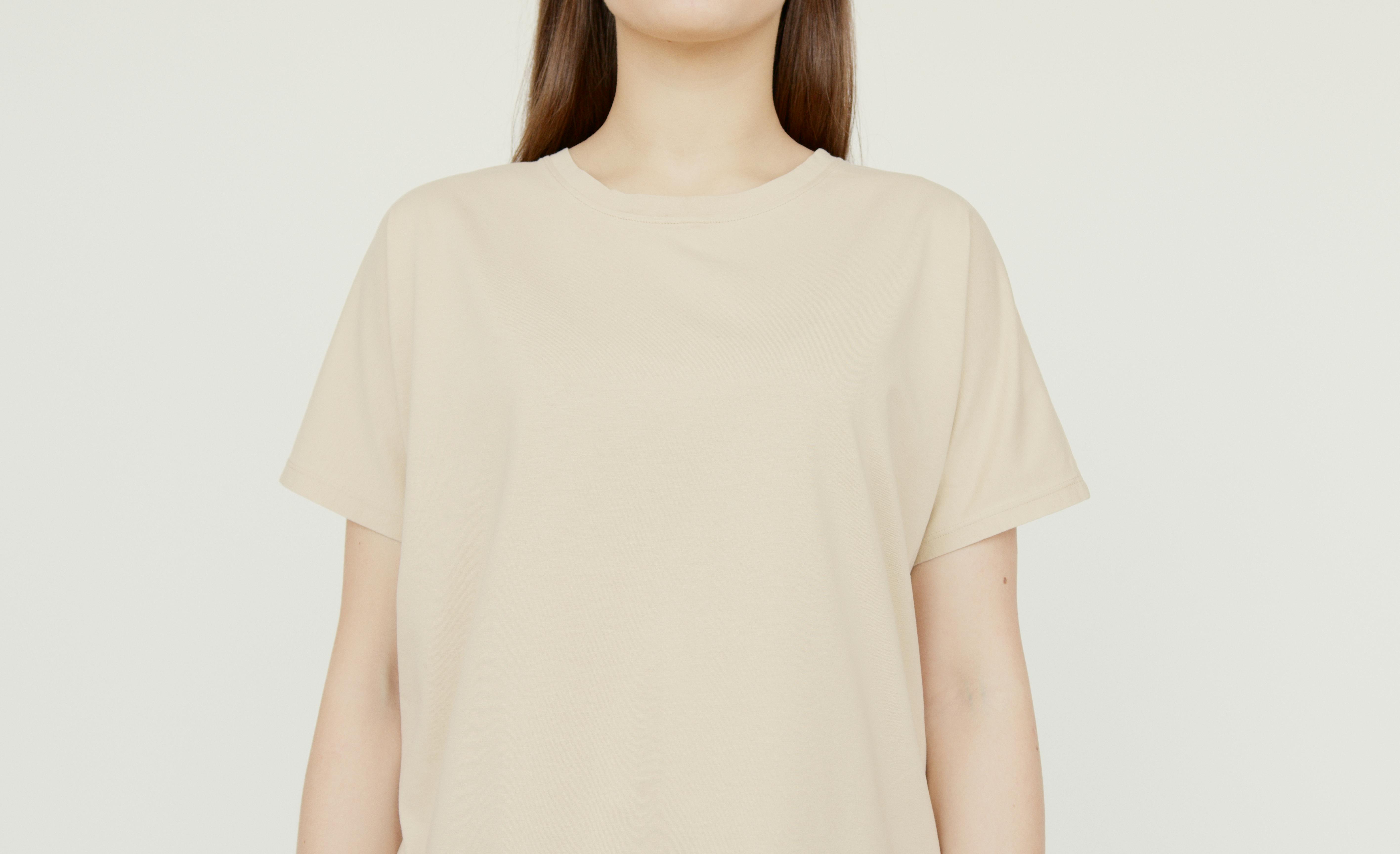 Catalogue image of a woman in a beige top and white background