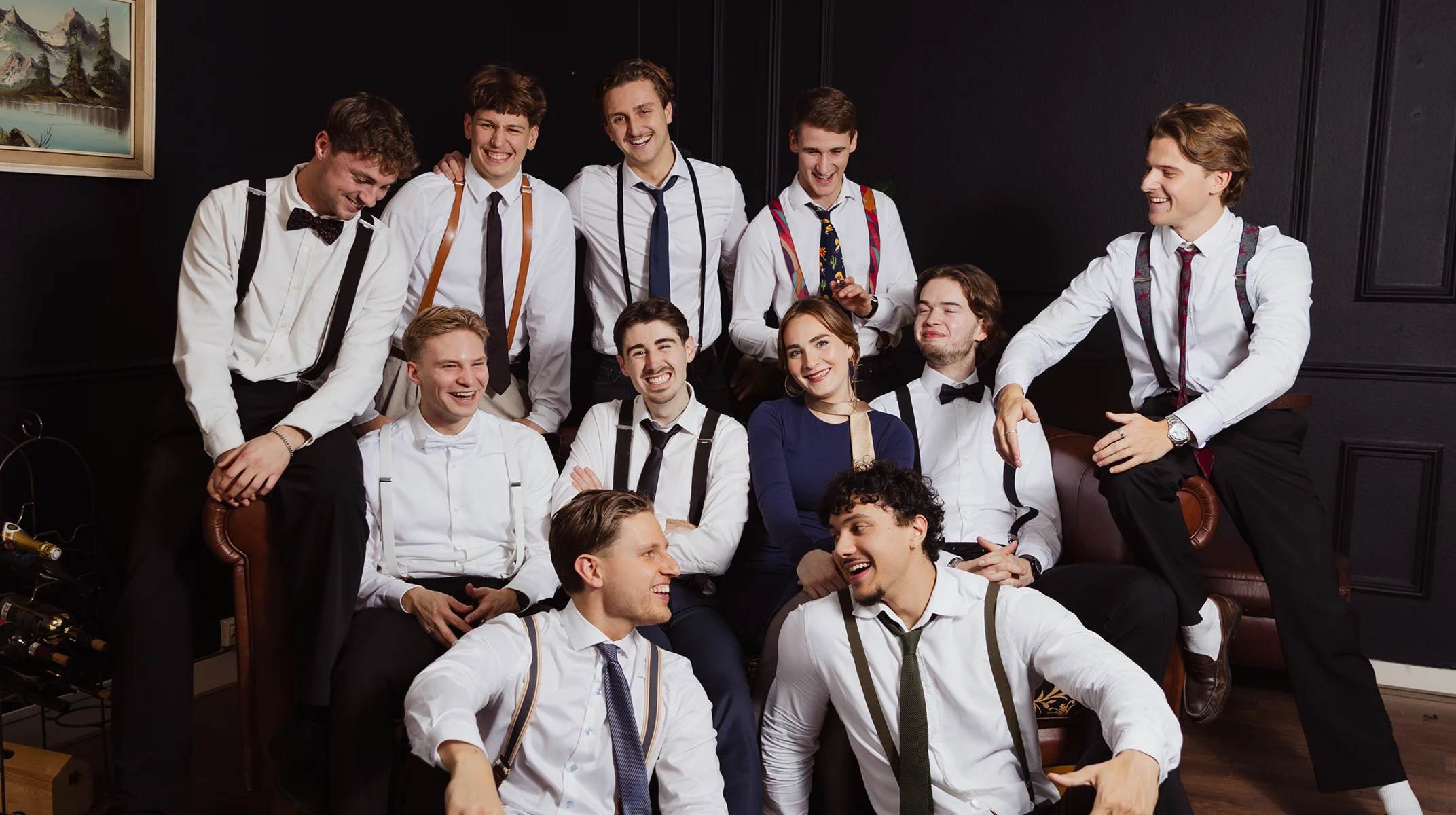 A red hot air balloon glows at sunset over mountains.
