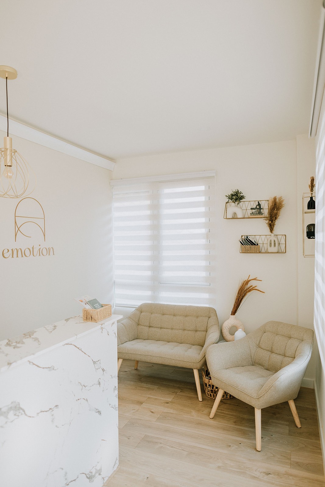A cozy scene with warm sunlight casting stripes, featuring a potted plant and soft towels on a window sill.