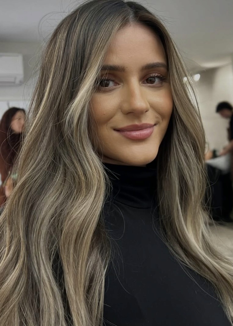 Brunette balayage with lived-in color, hair salon for textured hair, warm caramel highlights