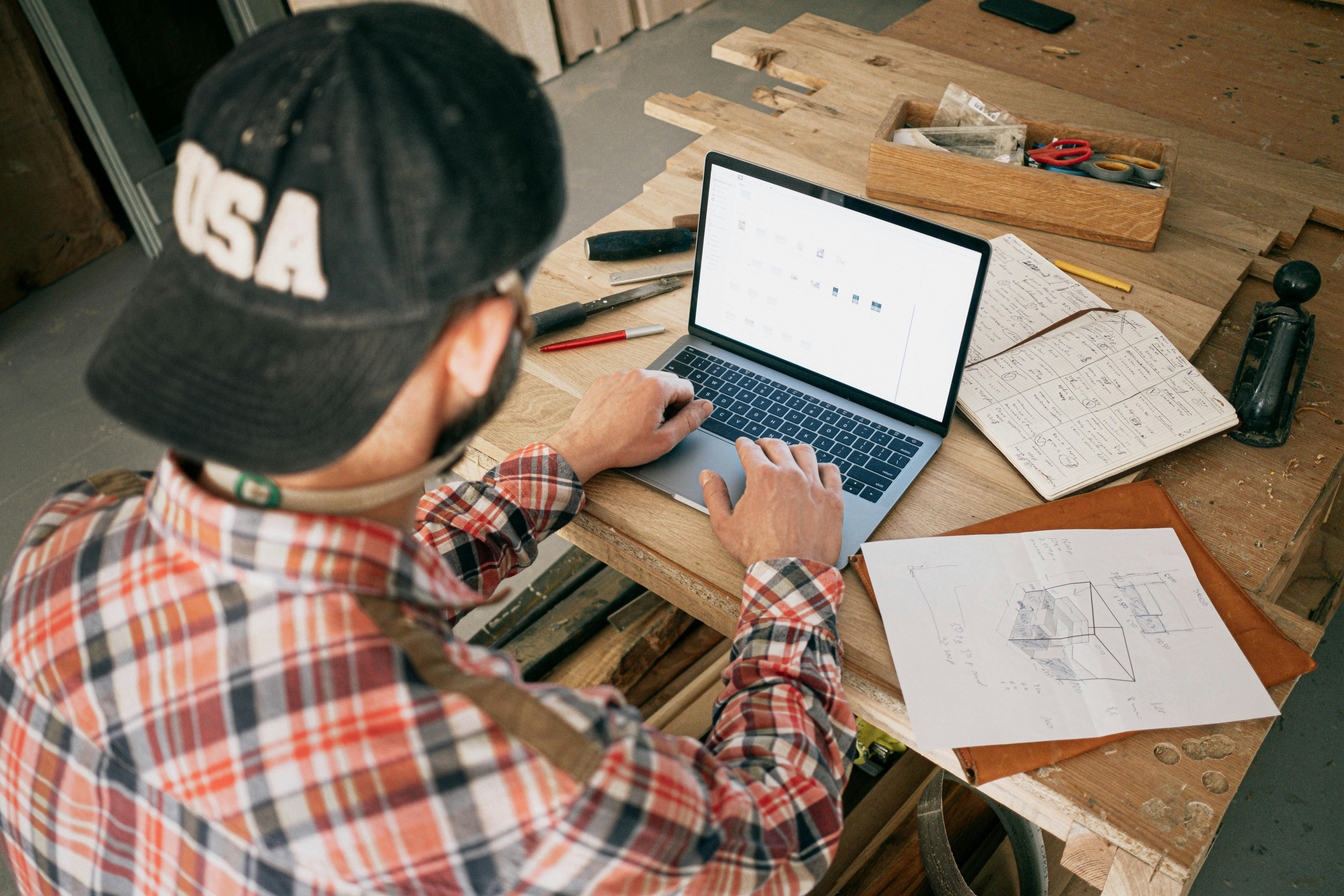 man drawing on dry-erase board