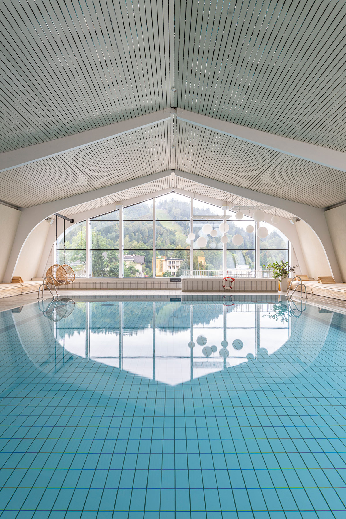 Indoor swimming pool at Hotel Park in Bled, Slovenia, photographed as part of hospitality interior coverage.