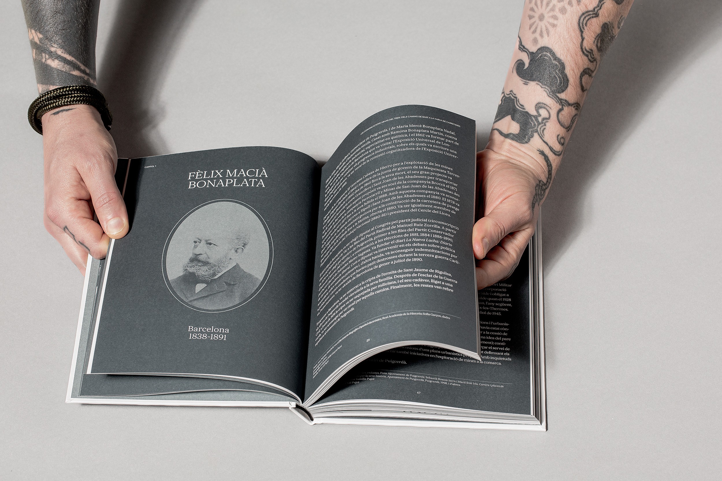 Stack of books with modern publishing design placed on bright white stairs