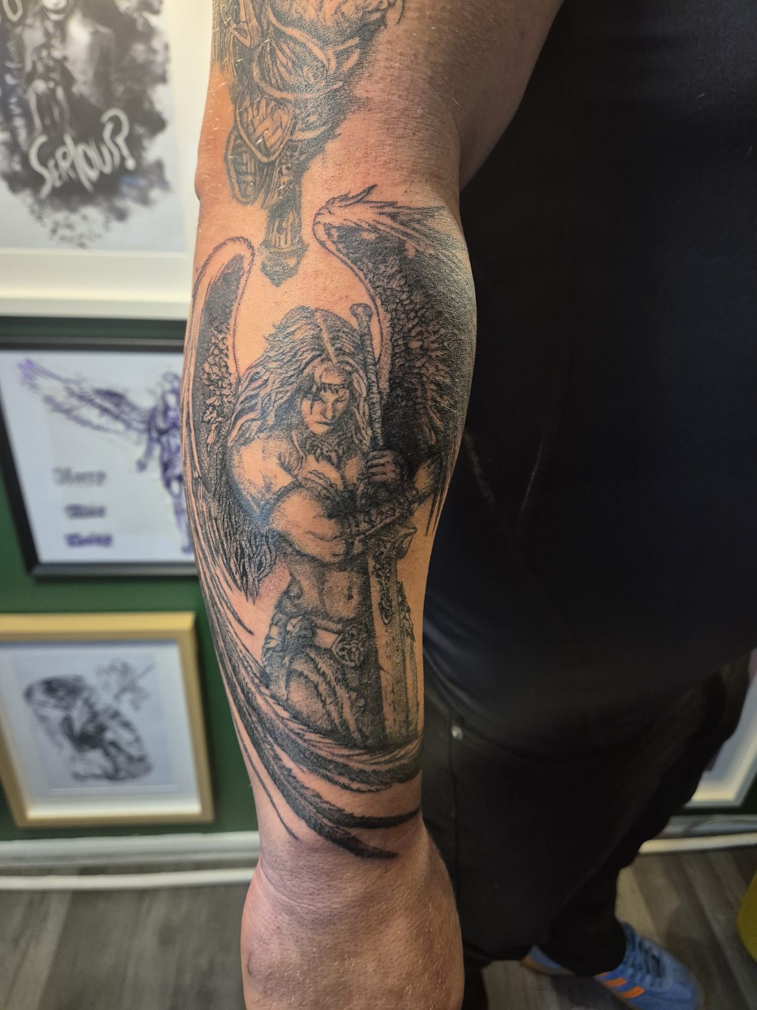 Black and grey tattoo sleeve with lion design in Hazel Grove