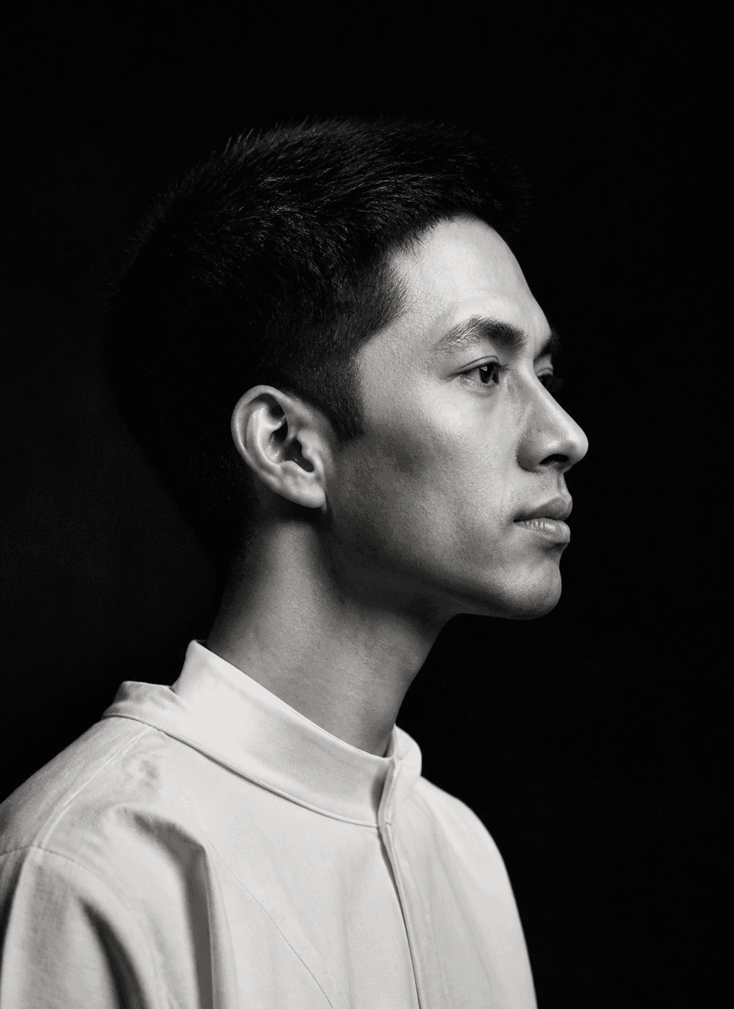 Leo Tanaka in sharp monochrome right-facing profile