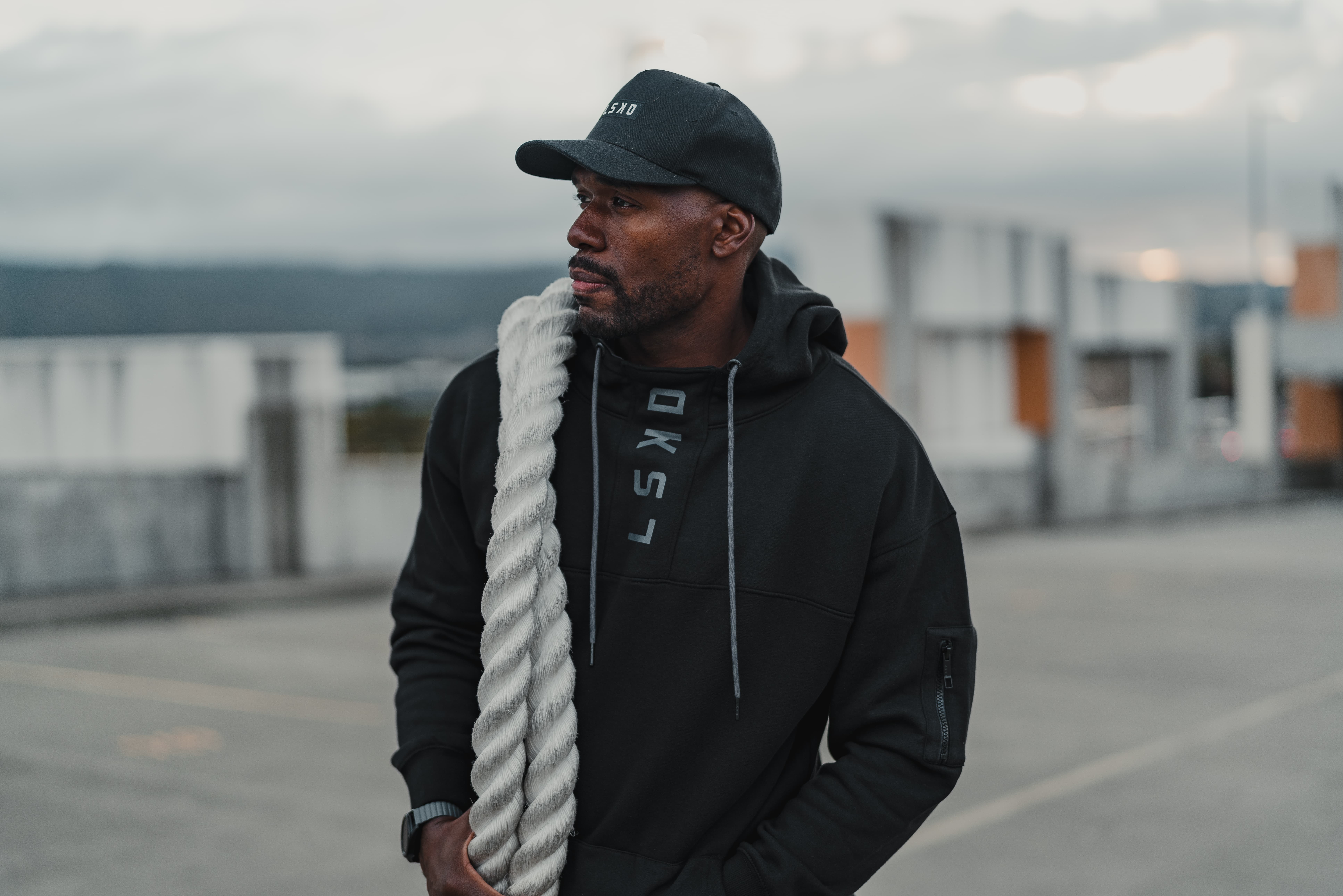 Rachel Stone standing with ABS and hands in her pockets