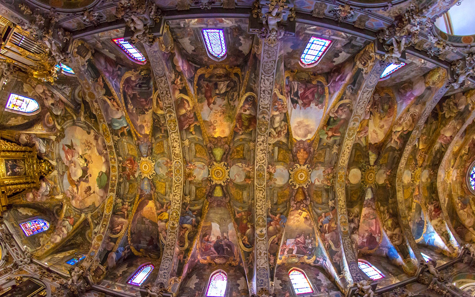 San Nicolas Church ceiling with intricate frescoes and stained glass windows, Valencia, Spain.