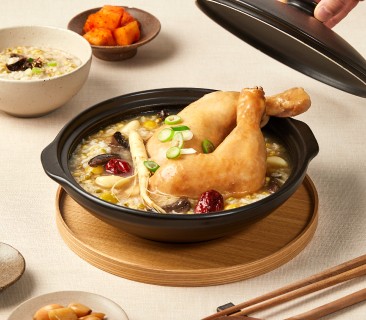 A man stading with Surfboard