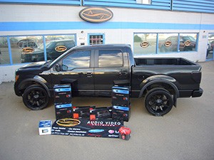 A person stands in a sandstone cave.
