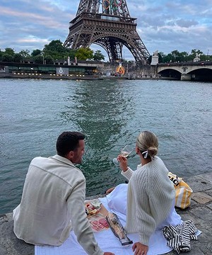flat lay shot of spa amenities by the bathtub
