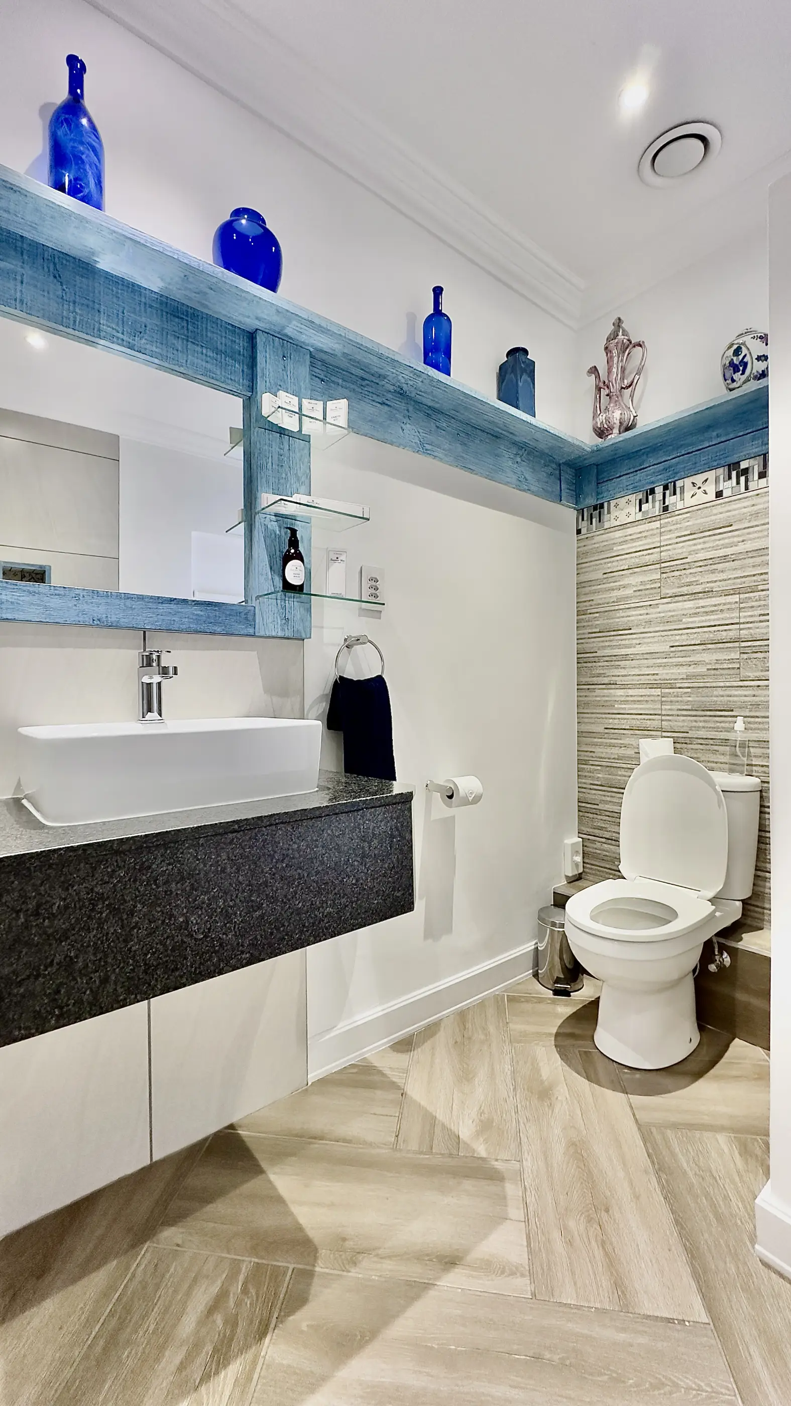 Bathroom basin and toilet area in our 3-Way View room.