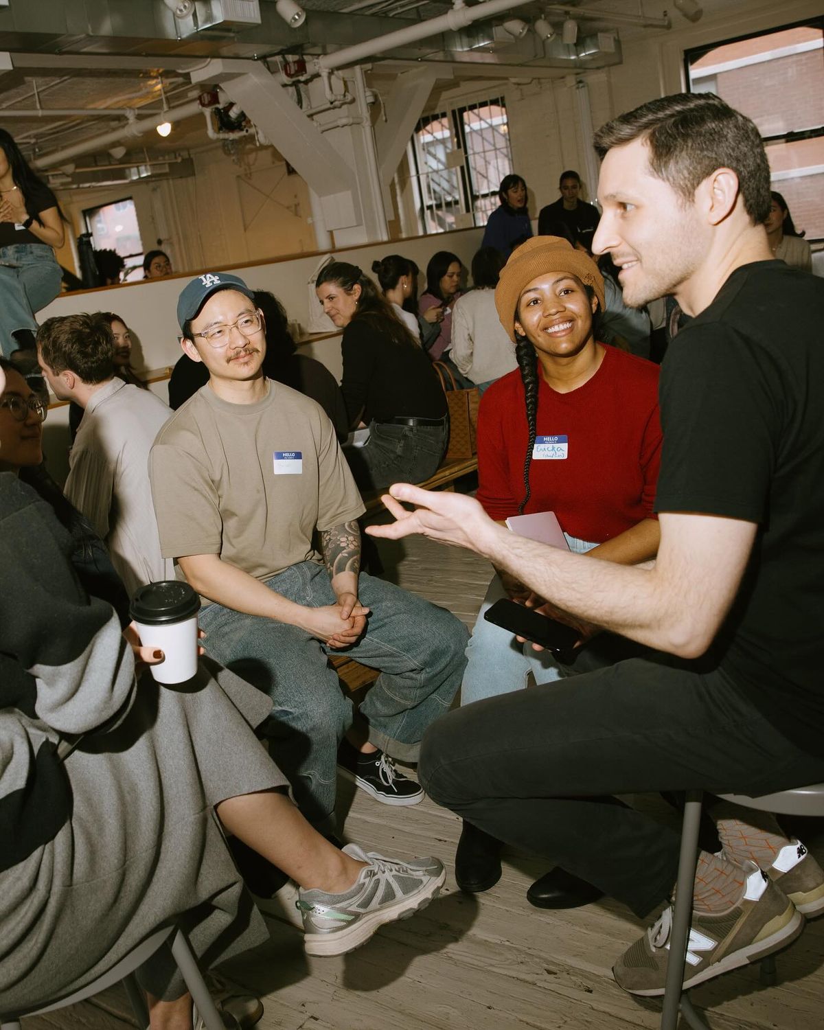 man in black and red shirt reading book