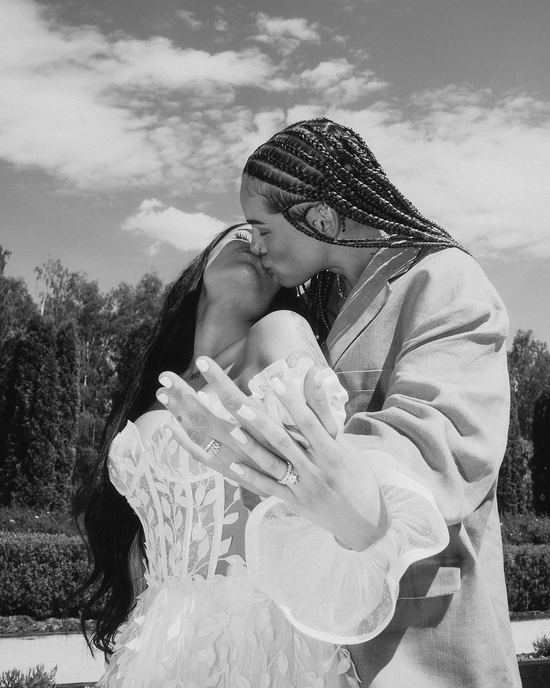 Black-and-white photograph of a couple kissing