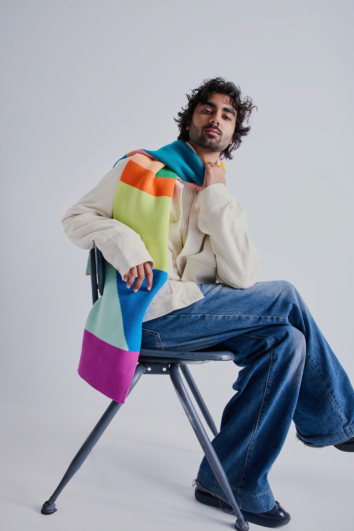 Young woman with dark hair and bangs, wearing red.