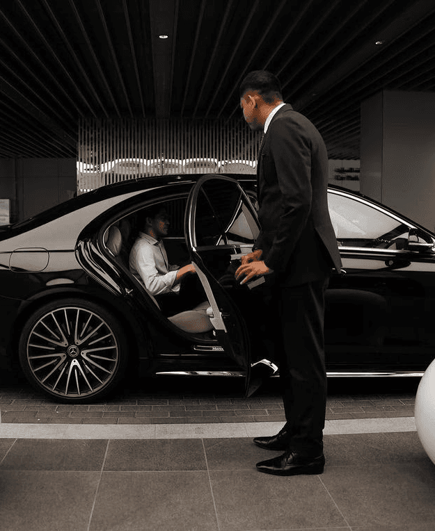 an airplane parked on the tarmac at sunset