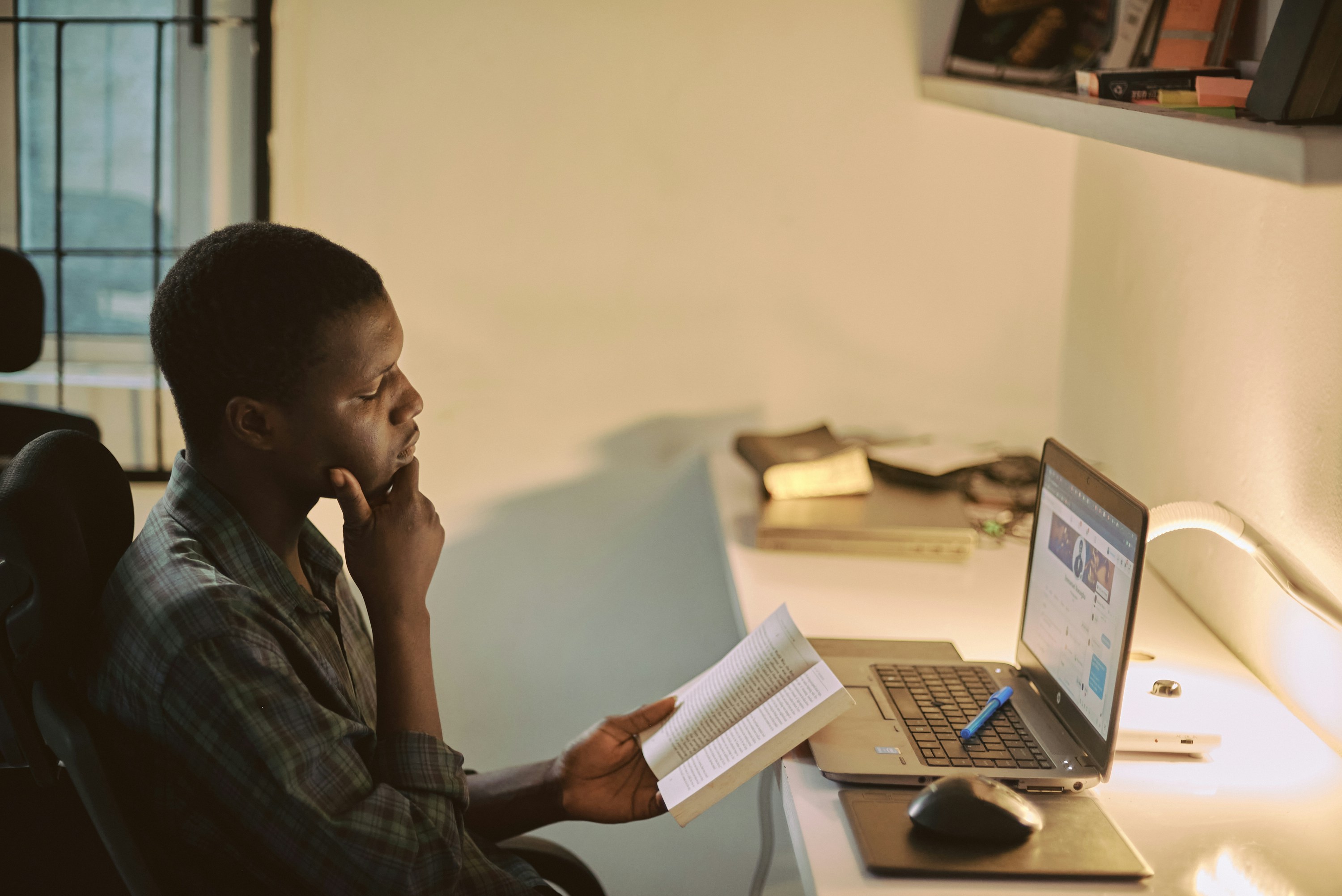 man reading a book - Graduate School Reading