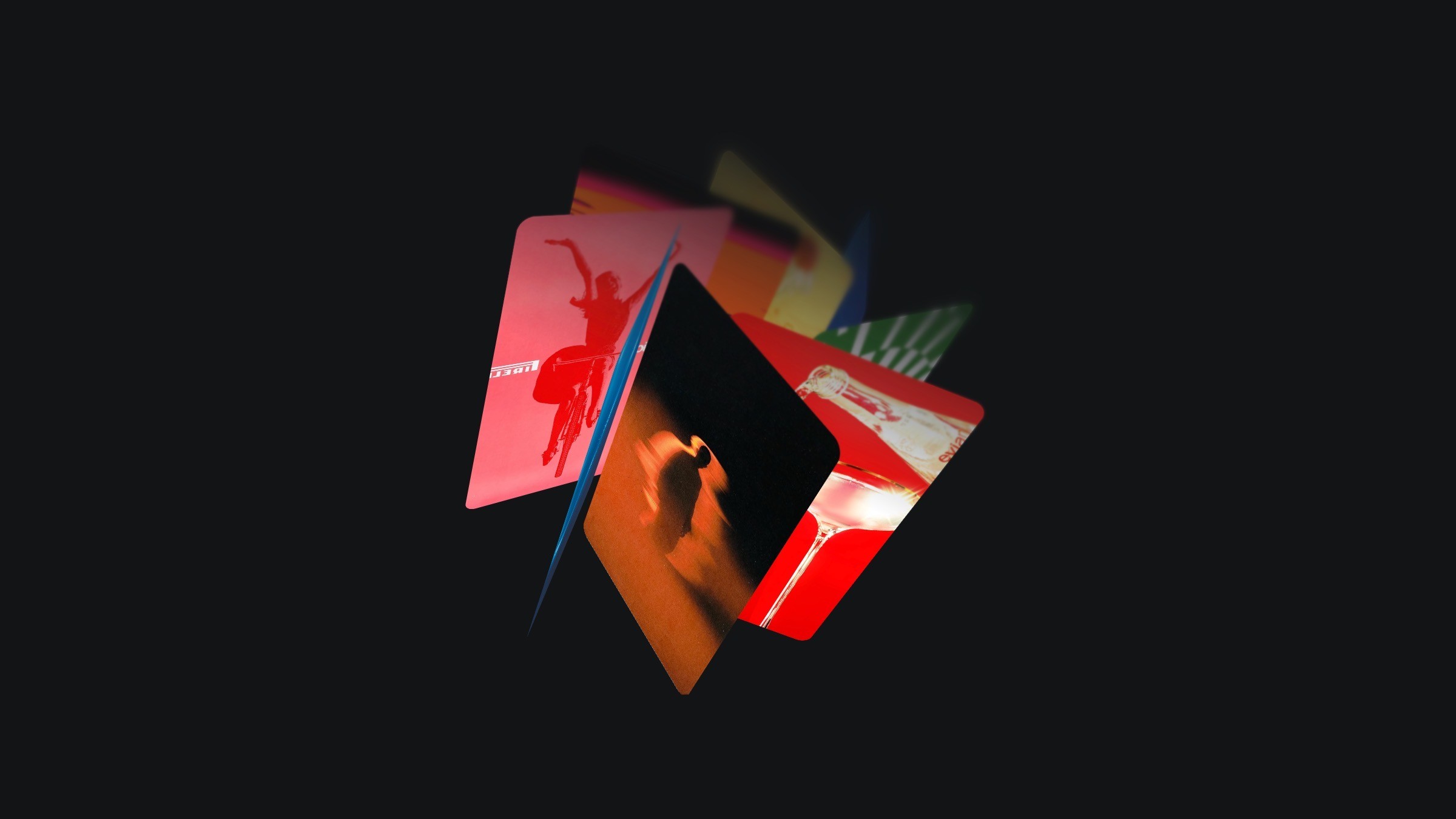 Rotating colorful cards on dark background