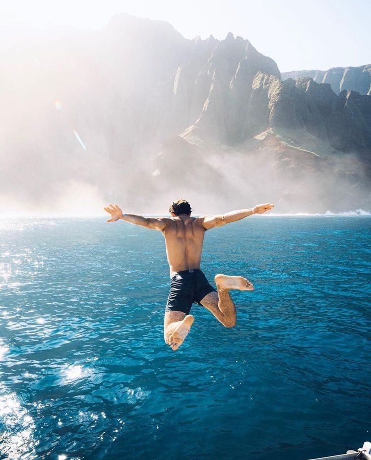 Shiba Inu dog jumping to catch falling autumn leaves