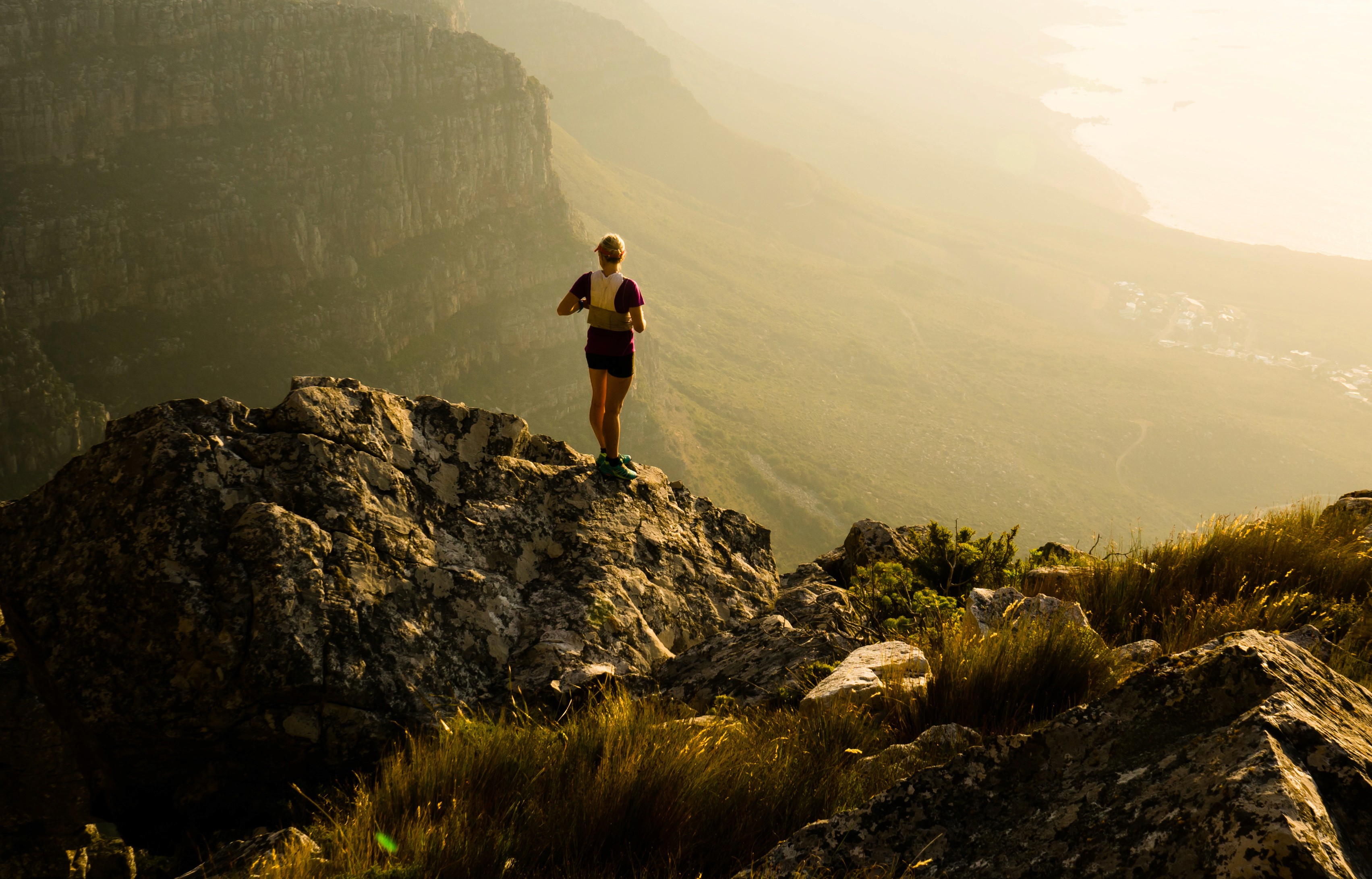 Mary Consolata Namagambe riding side saddle on a motorbike in Uganda, Africa