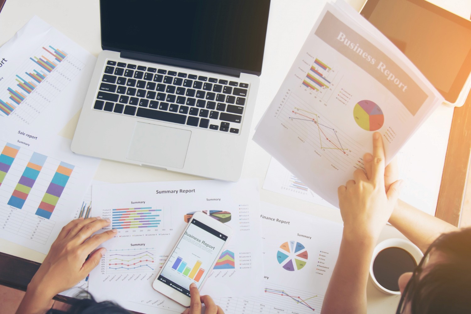 woman in white long sleeve shirt using black laptop computer