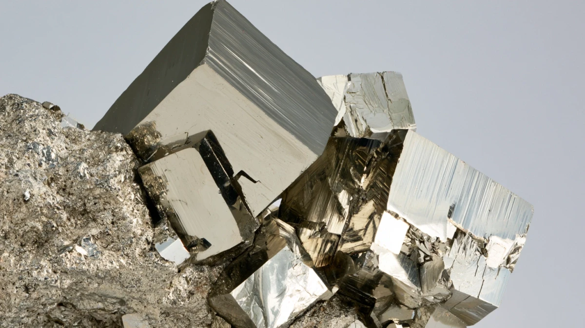Close-up of natural pyrite cubes with geometric crystal faces.